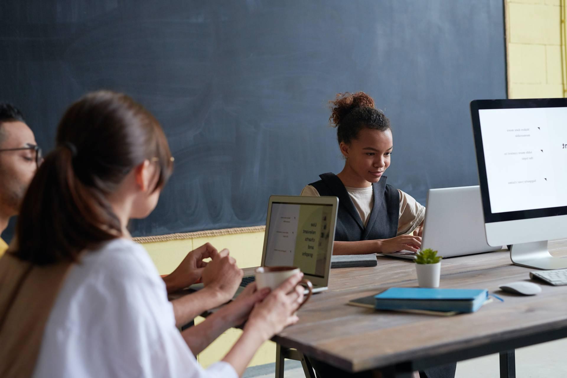 Students work on english homework in a classroom